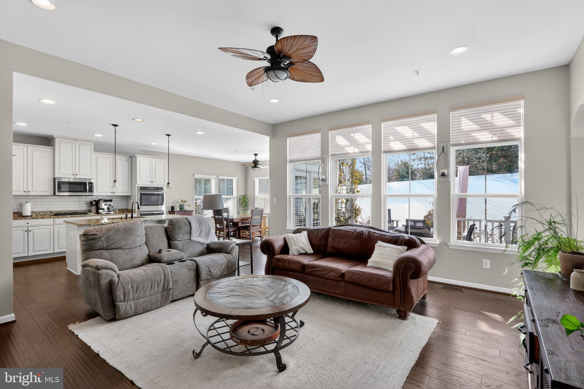 17518 Spring Cress Drive Dumfries, VA 22026 - Photo 11 of 37 a living room with furniture and a large window