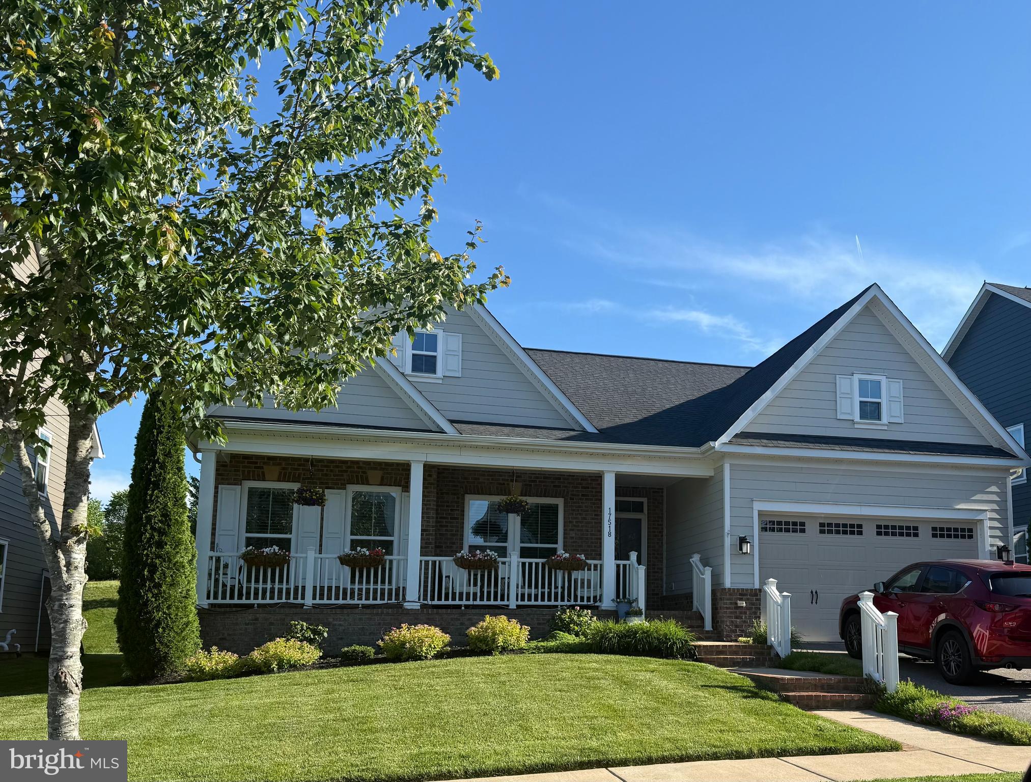 17518 Spring Cress Drive Dumfries, VA 22026 - Photo 2 of 37 a front view of a house with garden