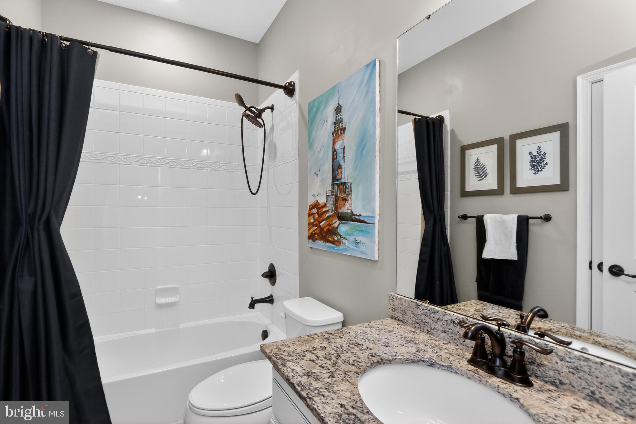 17518 Spring Cress Drive Dumfries, VA 22026 - Photo 26 of 37 a bathroom with a granite countertop sink toilet and shower
