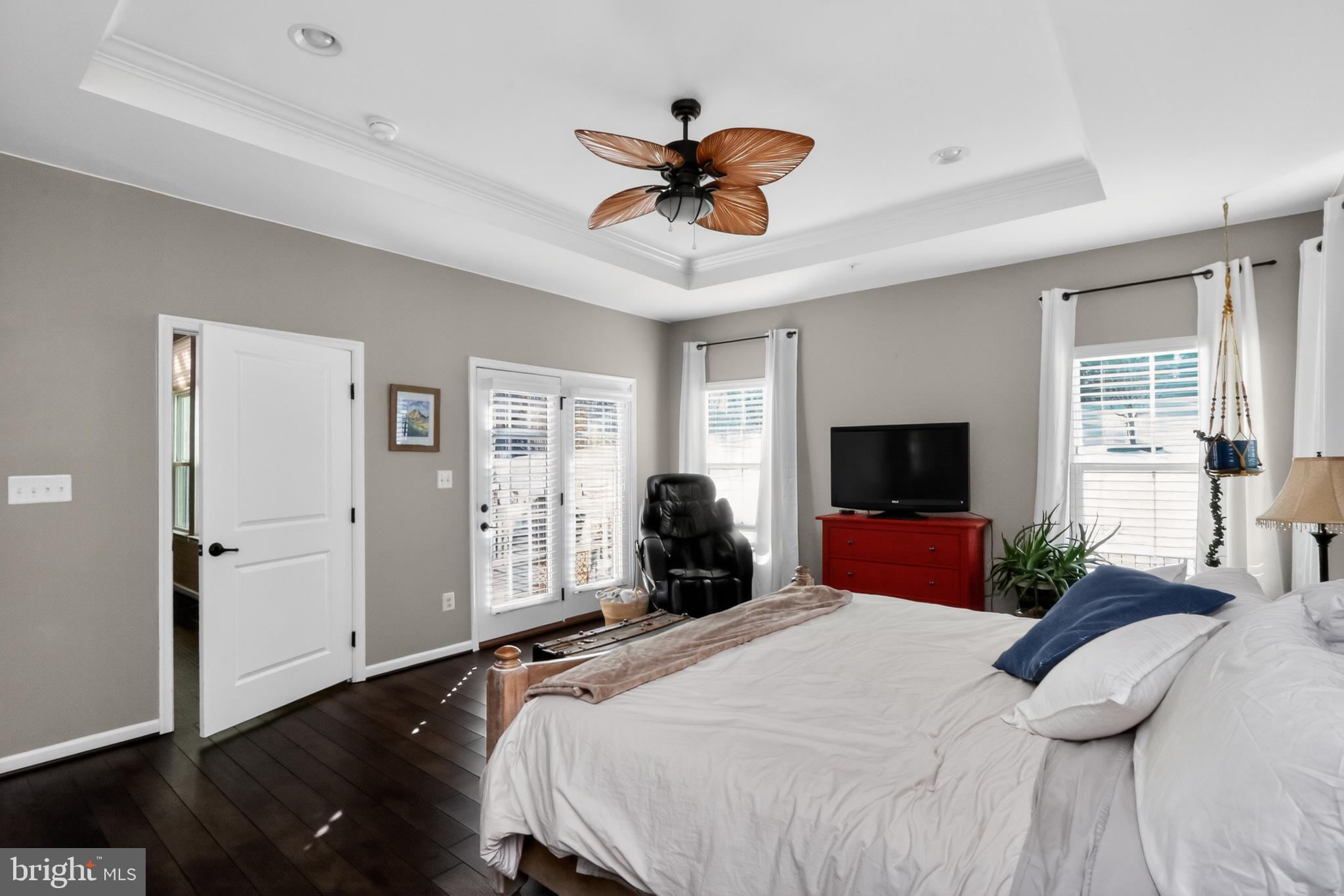 17518 Spring Cress Drive Dumfries, VA 22026 - Photo 27 of 89 a bedroom with a bed a window and a flat screen television