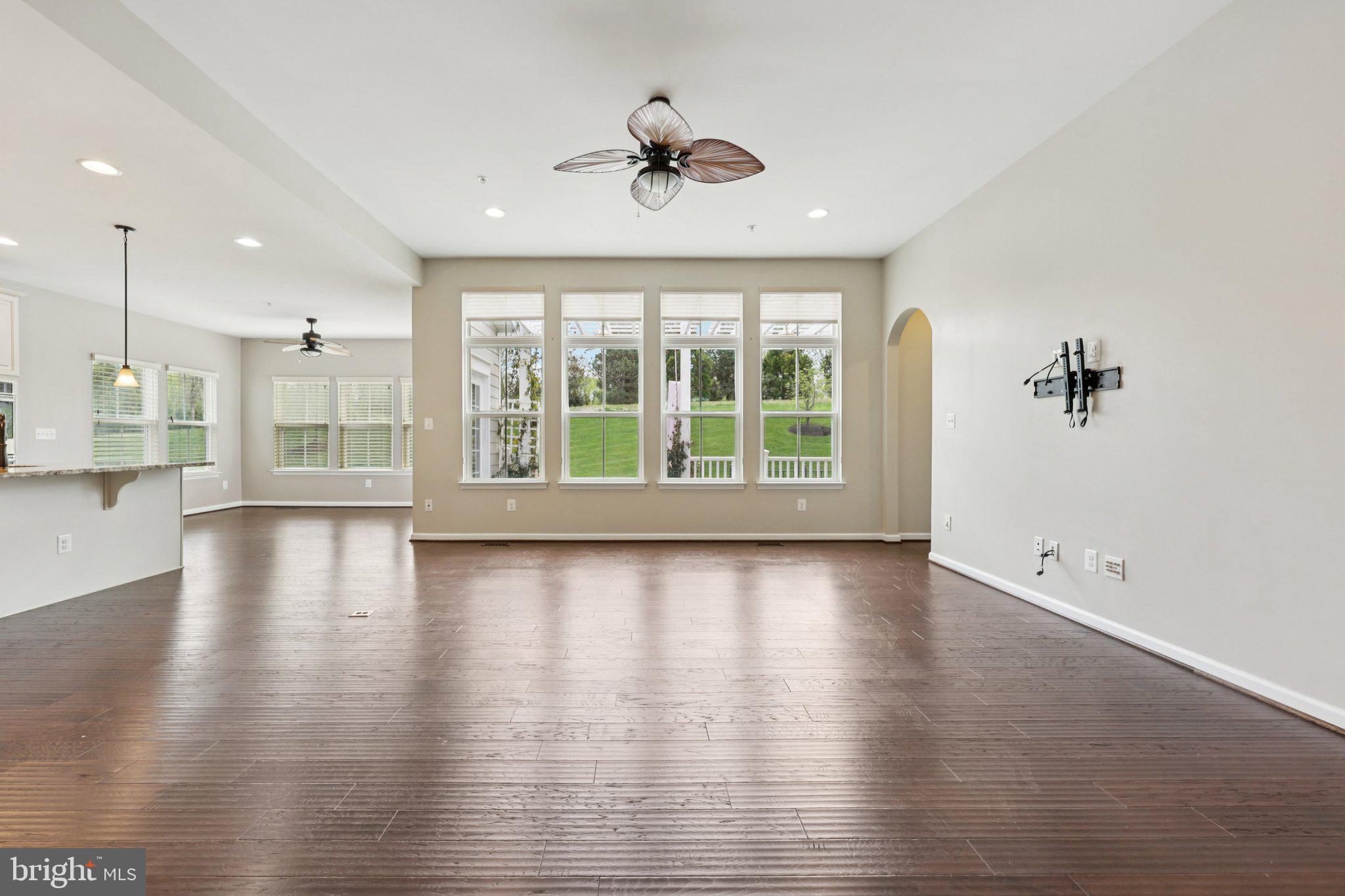 17518 Spring Cress Drive Dumfries, VA 22026 - Photo 32 of 89 a view of an empty room with a window and wooden floor