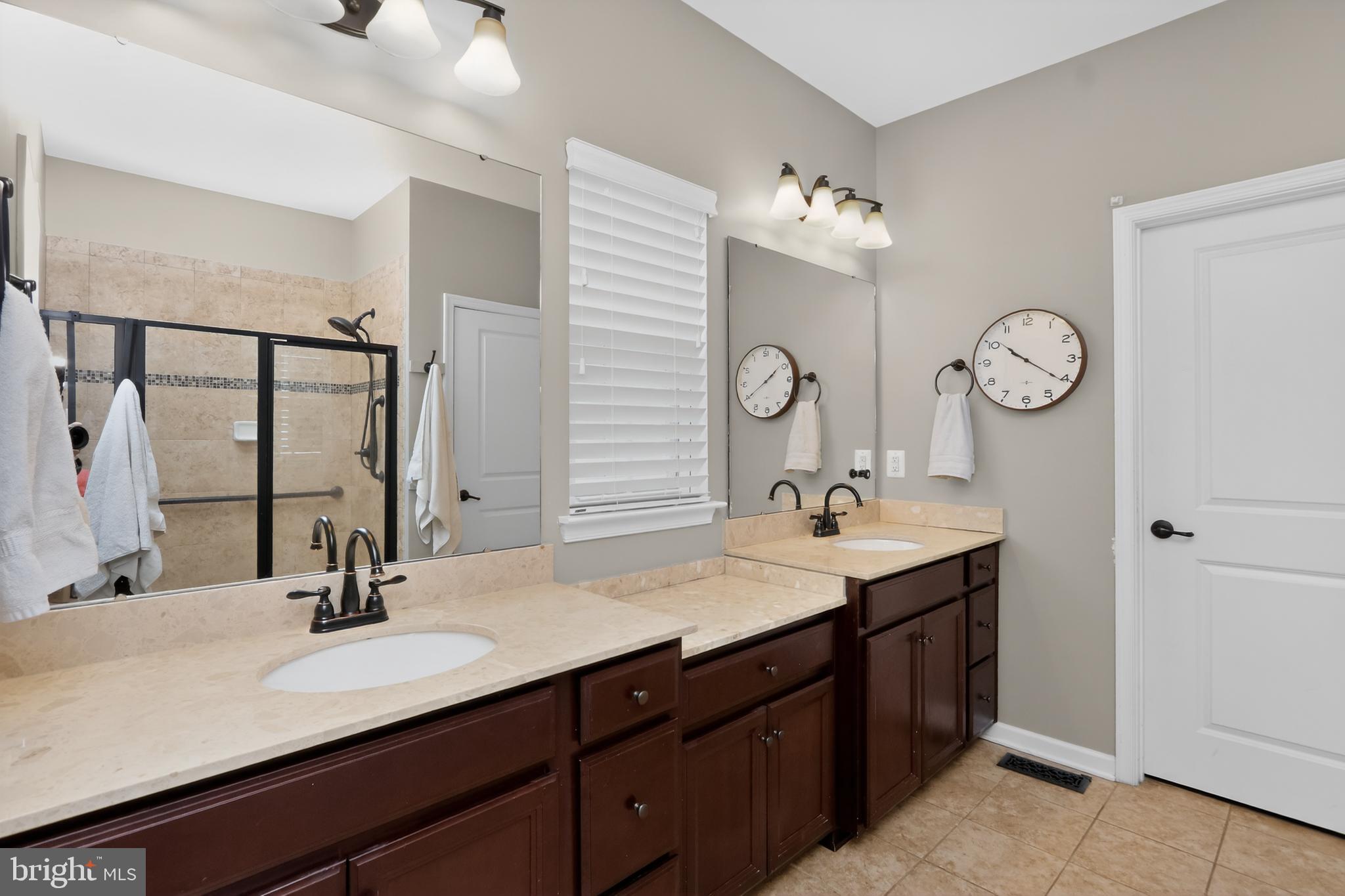 17518 Spring Cress Drive Dumfries, VA 22026 - Photo 35 of 89 a bathroom with double vanity sinks and a mirror