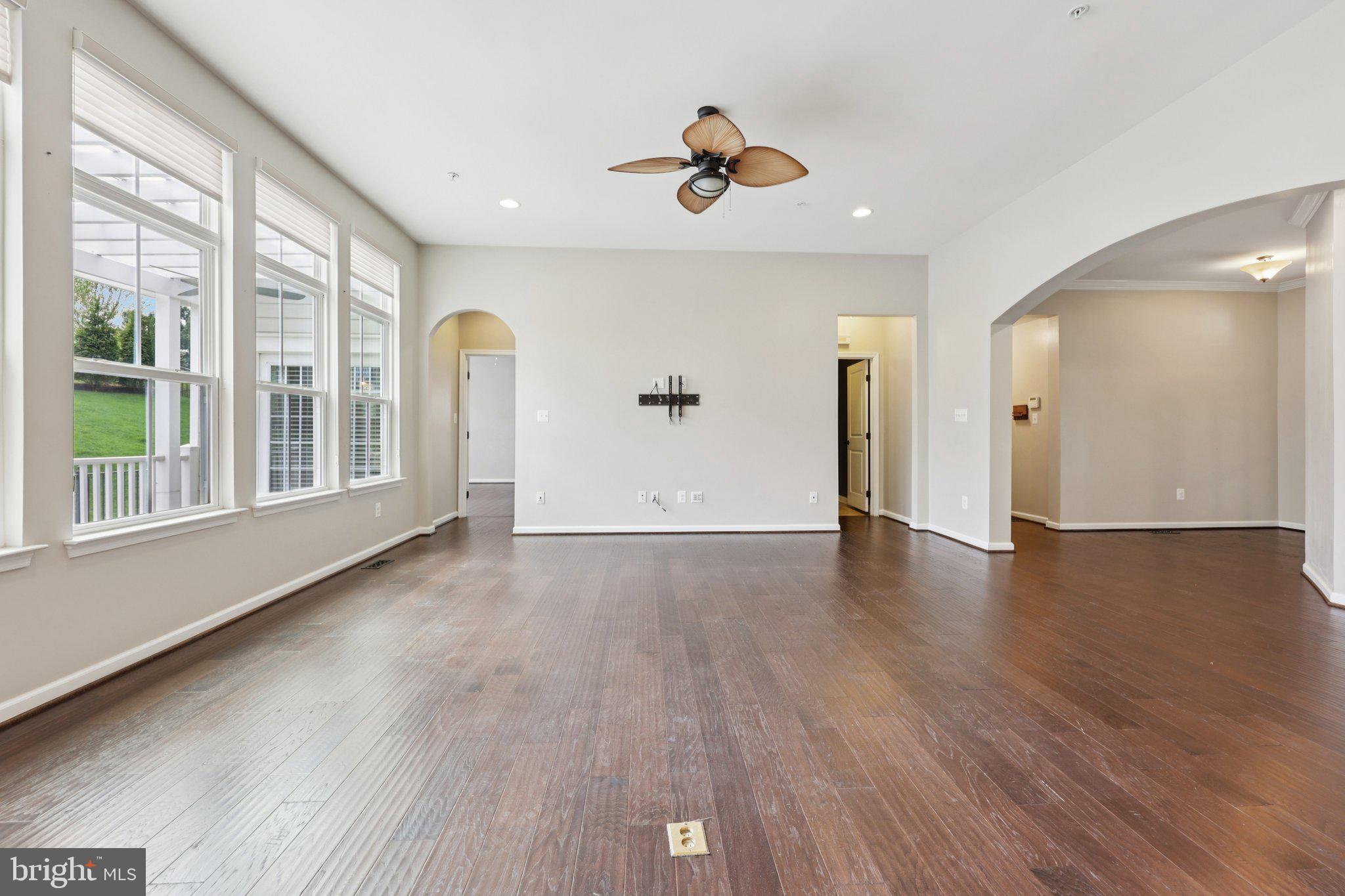 17518 Spring Cress Drive Dumfries, VA 22026 - Photo 38 of 89 a view of a livingroom with wooden floor and a large window