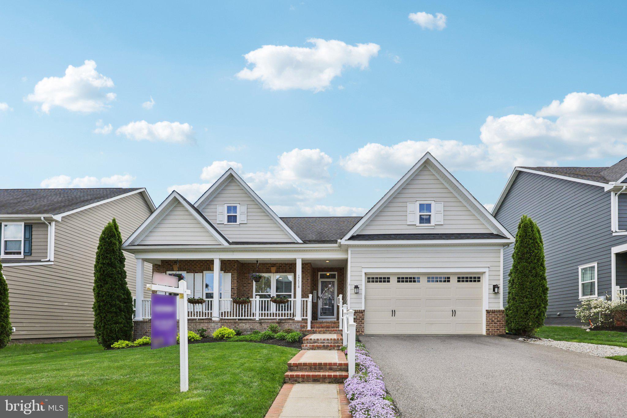 17518 Spring Cress Drive Dumfries, VA 22026 - Photo 4 of 89 a front view of a house with a yard and potted plants