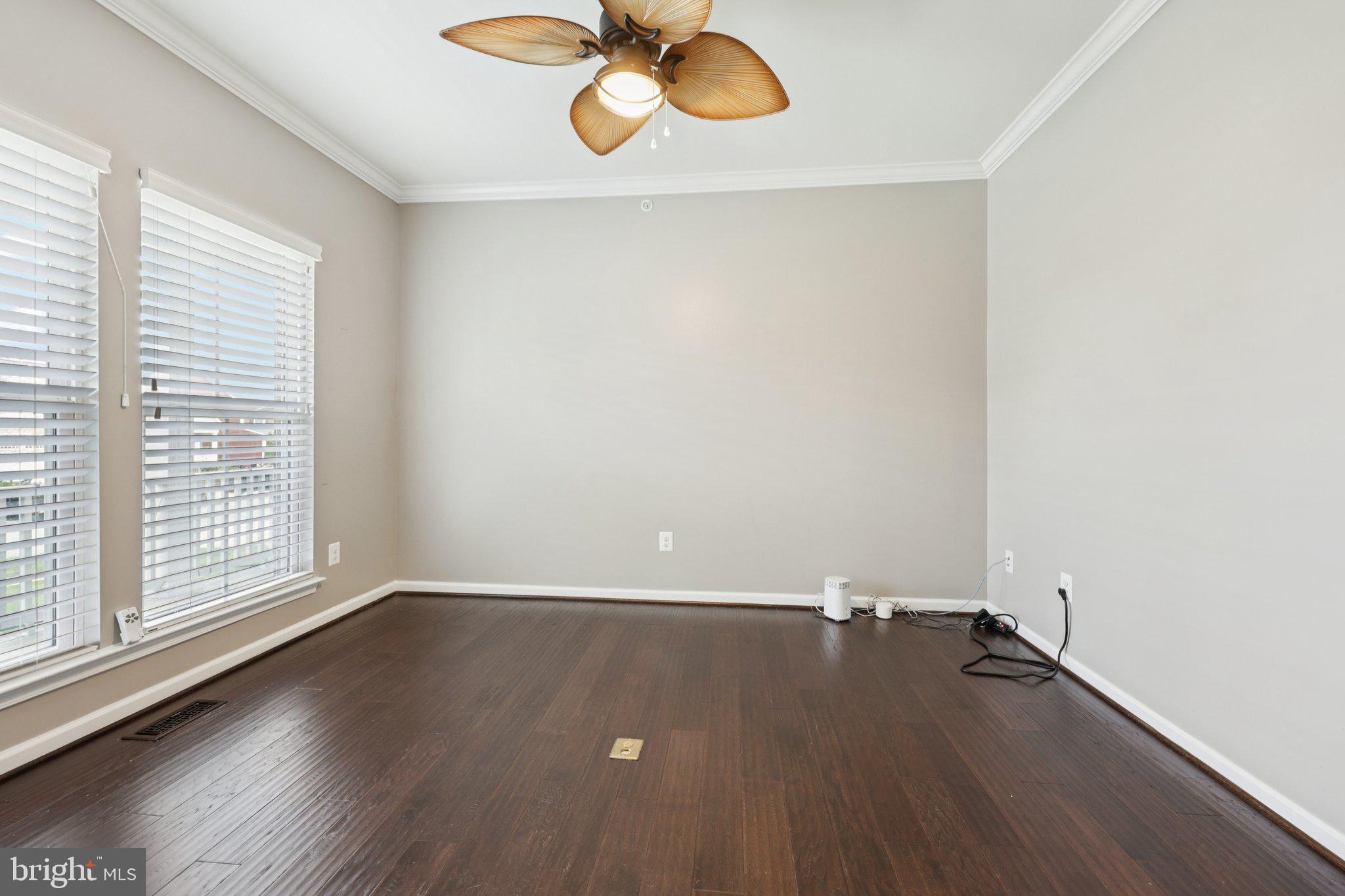 17518 Spring Cress Drive Dumfries, VA 22026 - Photo 44 of 89 an empty room with wooden floor and windows