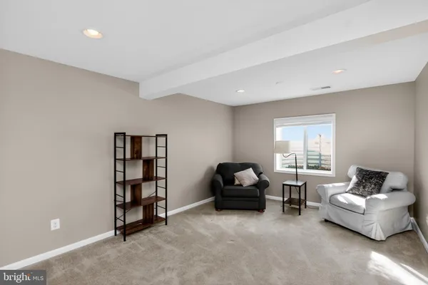 a front view of house with yard barbeque and outdoor seating