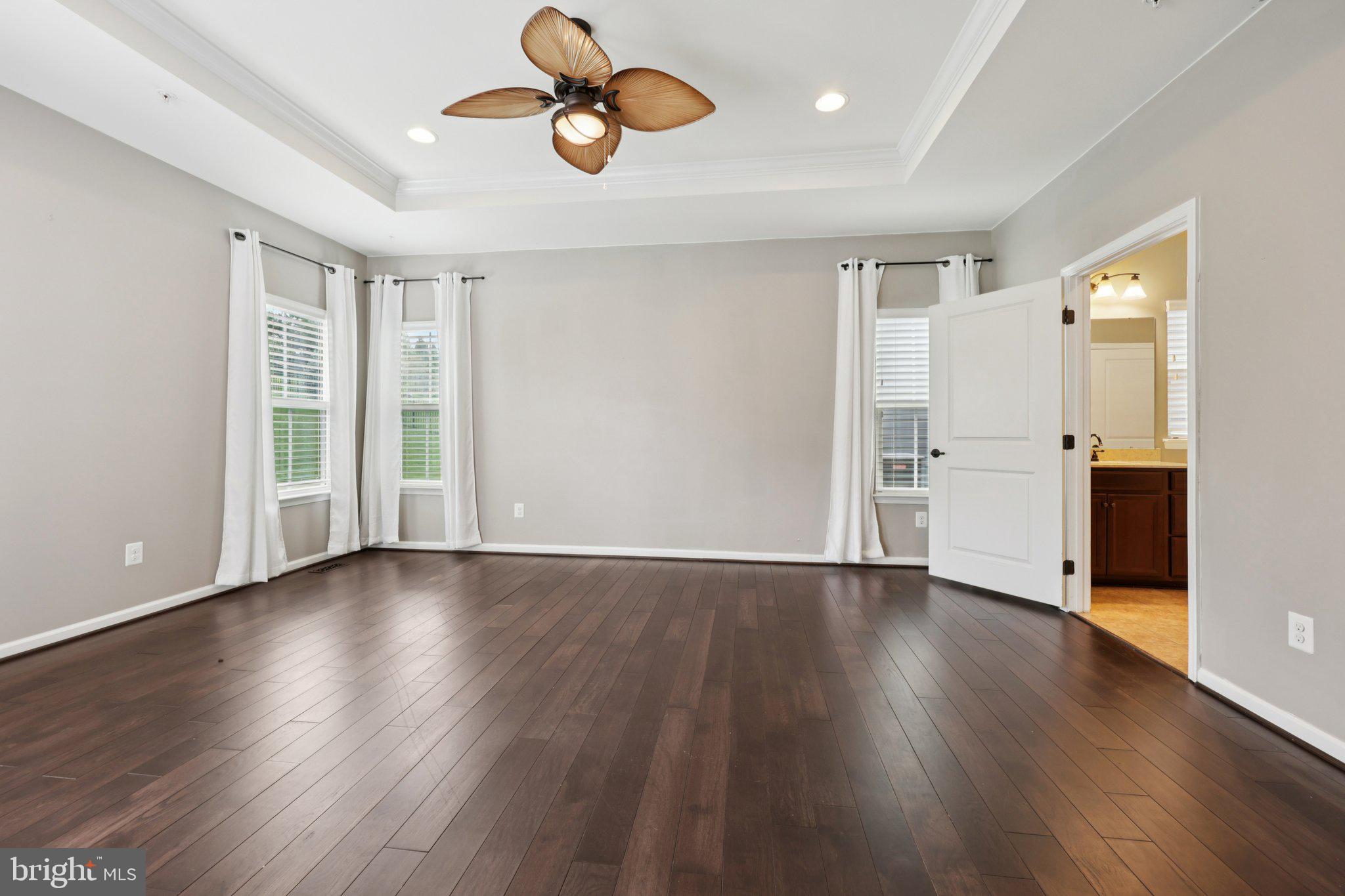 17518 Spring Cress Drive Dumfries, VA 22026 - Photo 50 of 89 a view of an empty room with wooden floor and a window