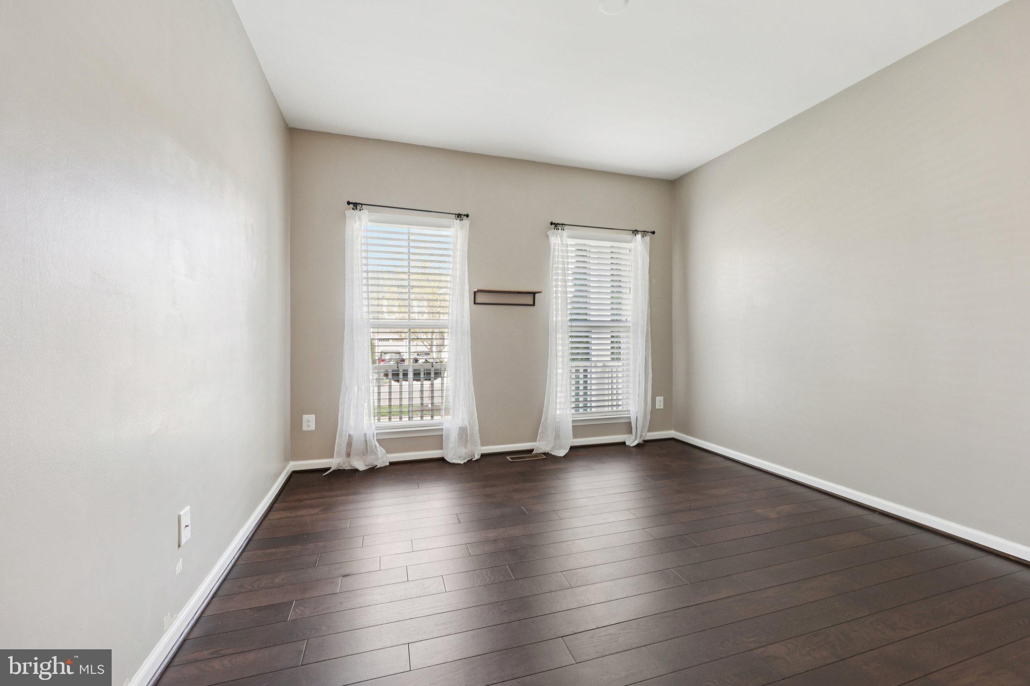 17518 Spring Cress Drive Dumfries, VA 22026 - Photo 54 of 89 an empty room with wooden floor and windows