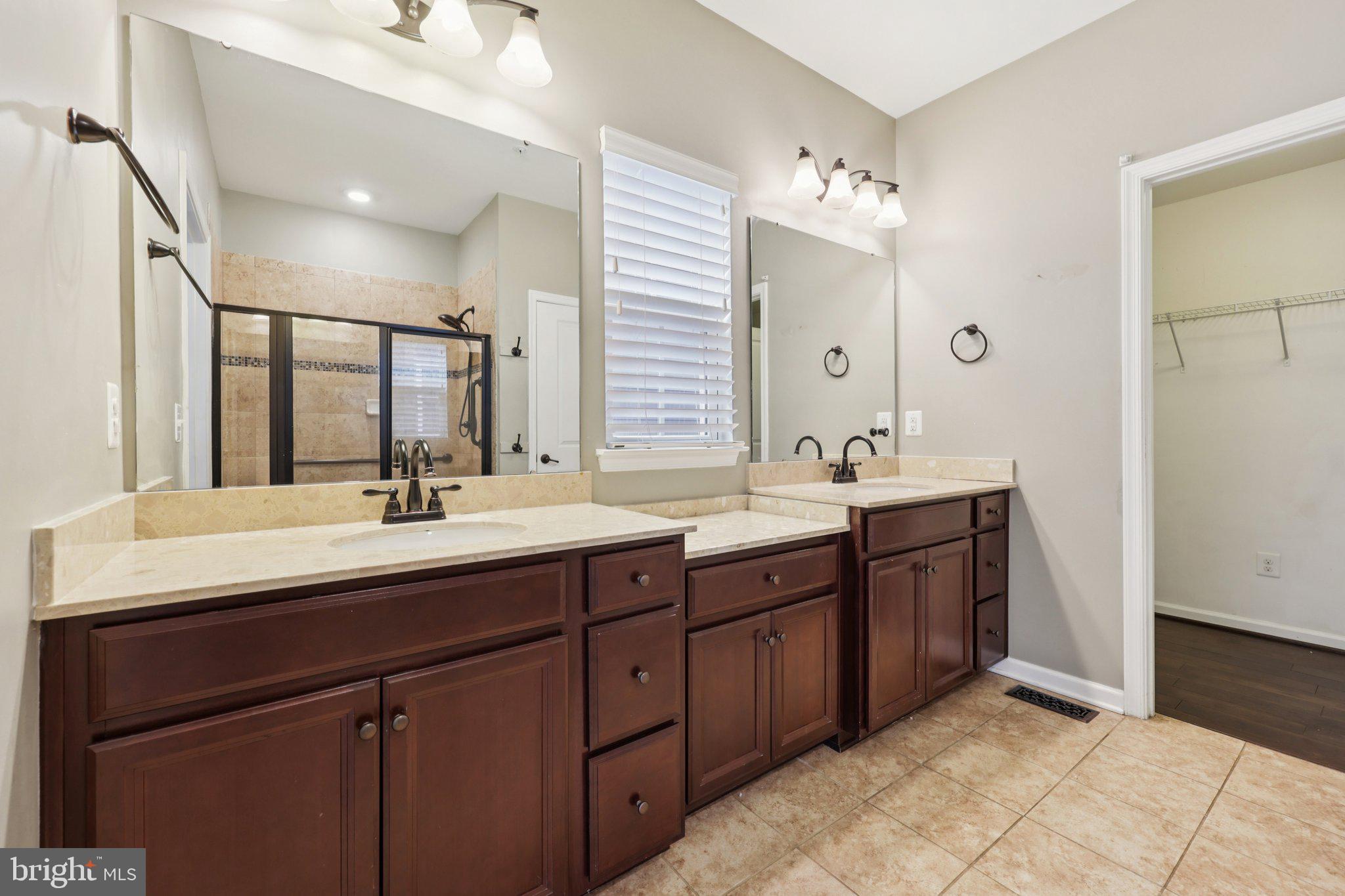 17518 Spring Cress Drive Dumfries, VA 22026 - Photo 62 of 89 a bathroom with a double vanity sink and mirror