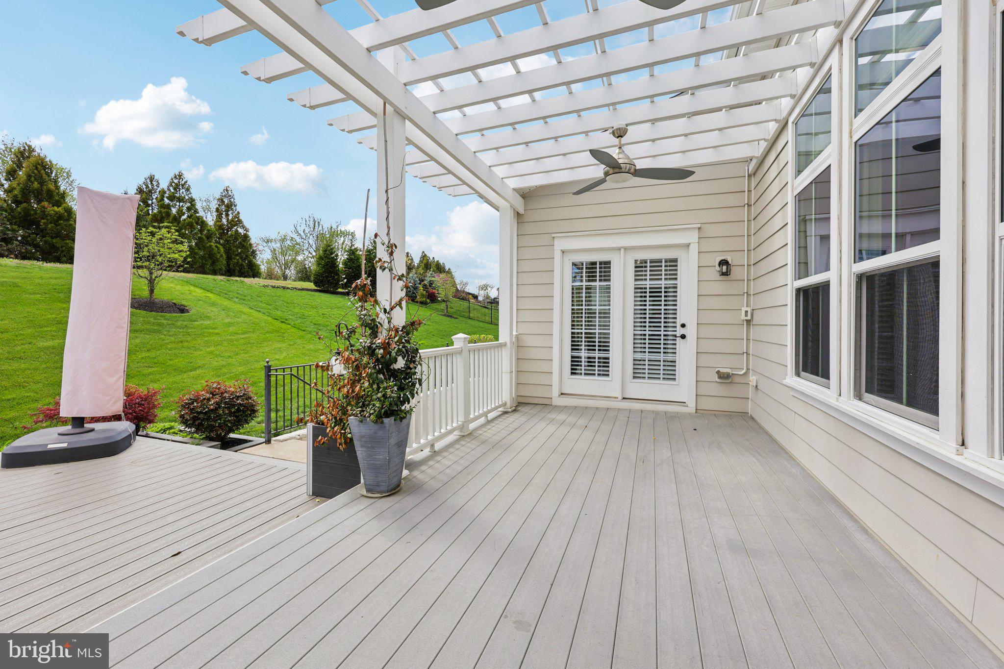 17518 Spring Cress Drive Dumfries, VA 22026 - Photo 85 of 89 a porch with seating space and hardwood floor