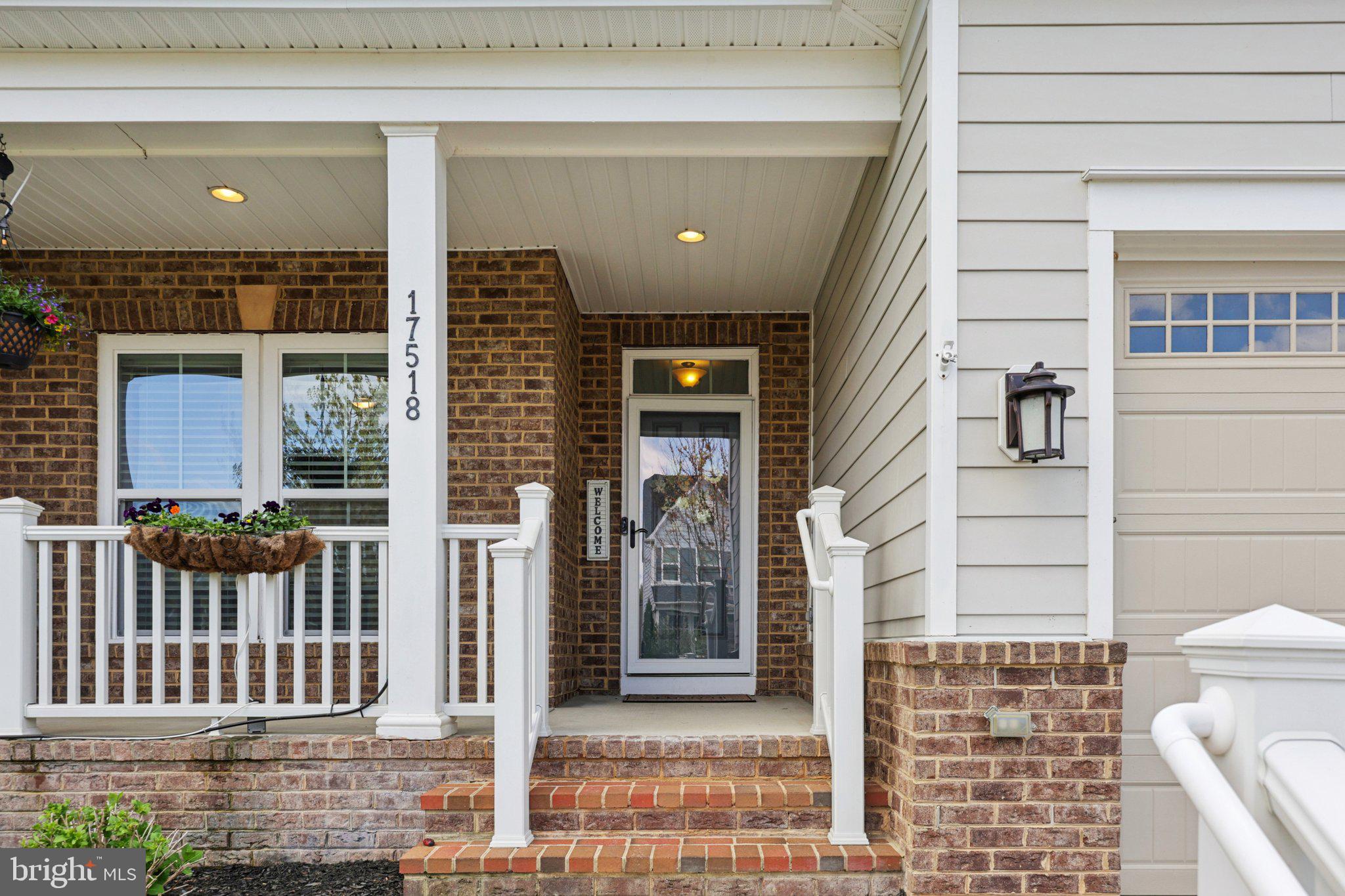 17518 Spring Cress Drive Dumfries, VA 22026 - Photo 10 of 89 a front view of a building with a glass door