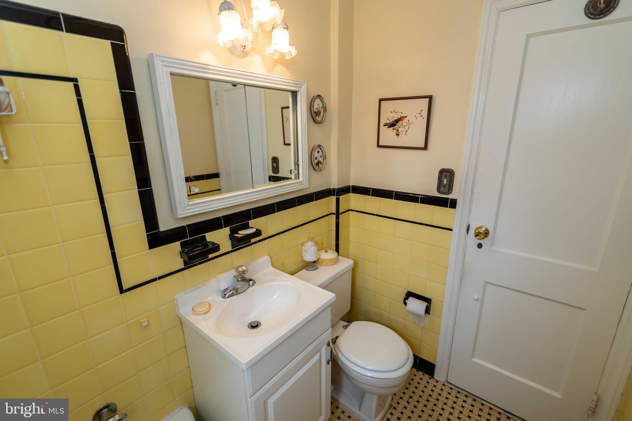 704 Hood Road Swarthmore, PA 19081 - Photo 16 of 34 a bathroom with a sink toilet and mirror