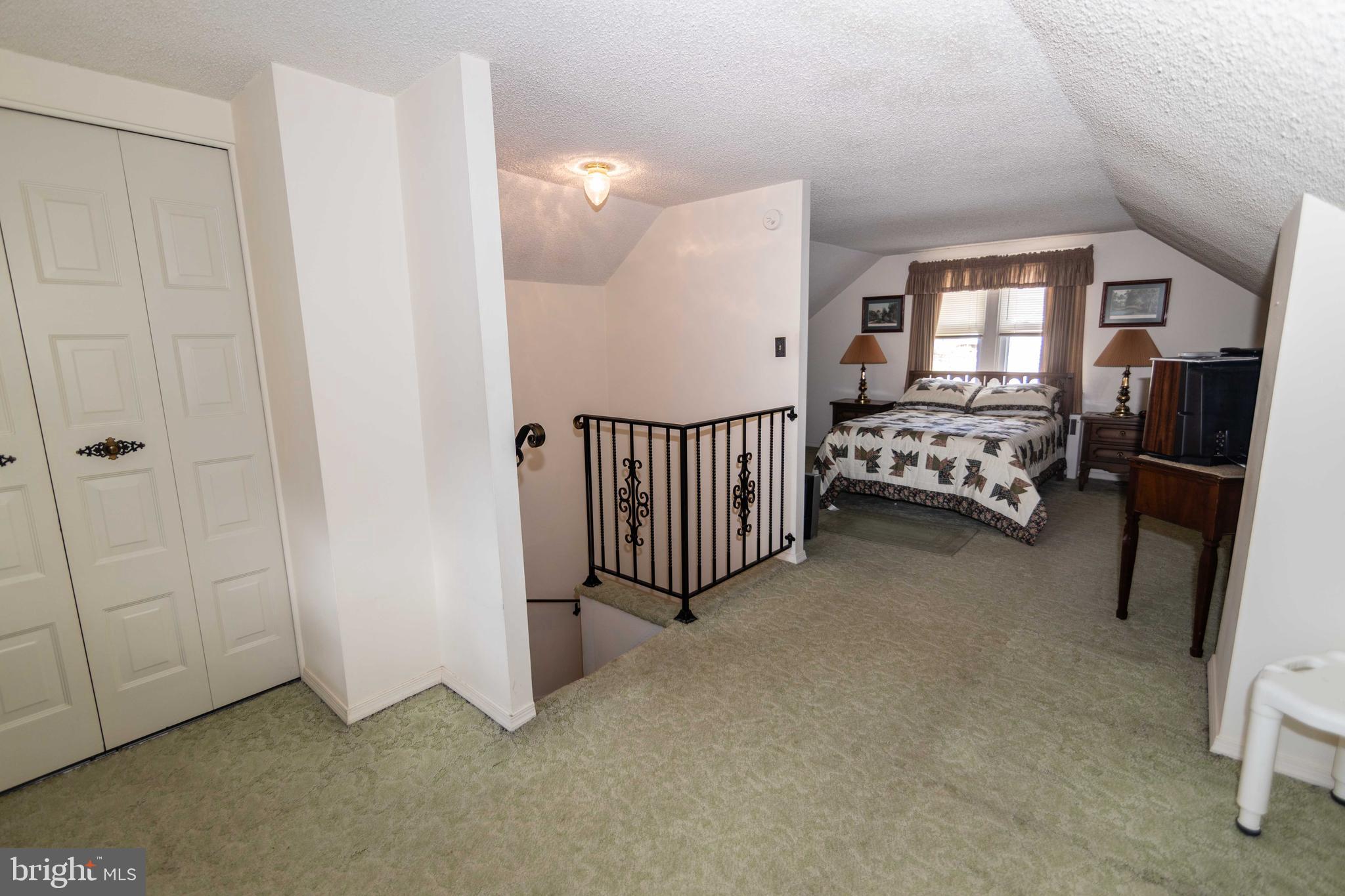 704 Hood Road Swarthmore, PA 19081 - Photo 17 of 34 a view of a livingroom with furniture and staircase