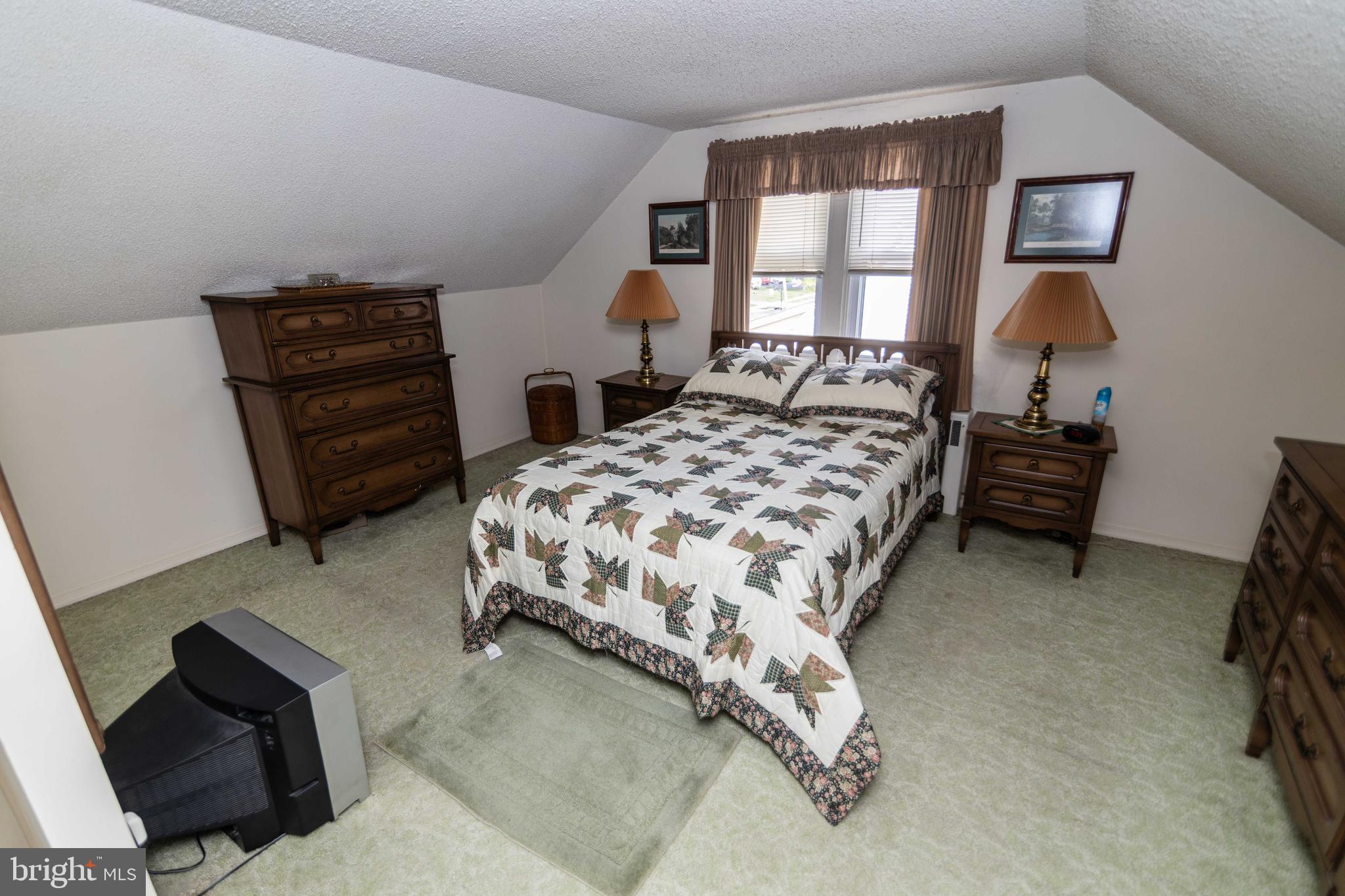 704 Hood Road Swarthmore, PA 19081 - Photo 19 of 34 a bedroom with a bed and a dresser
