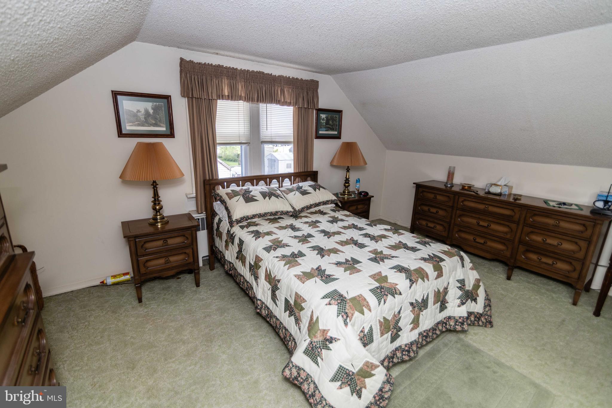 704 Hood Road Swarthmore, PA 19081 - Photo 20 of 34 a bedroom with a bed and window