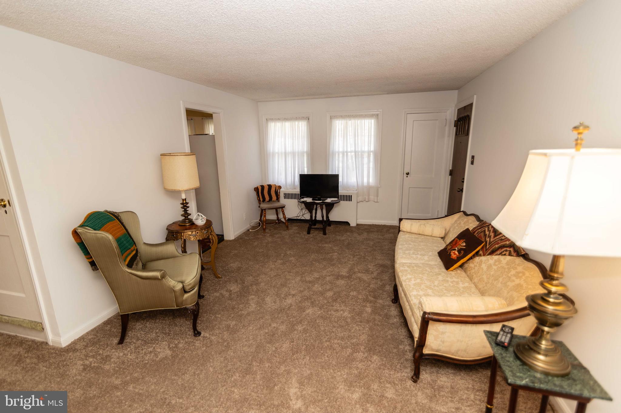704 Hood Road Swarthmore, PA 19081 - Photo 2 of 34 a living room with furniture and a window