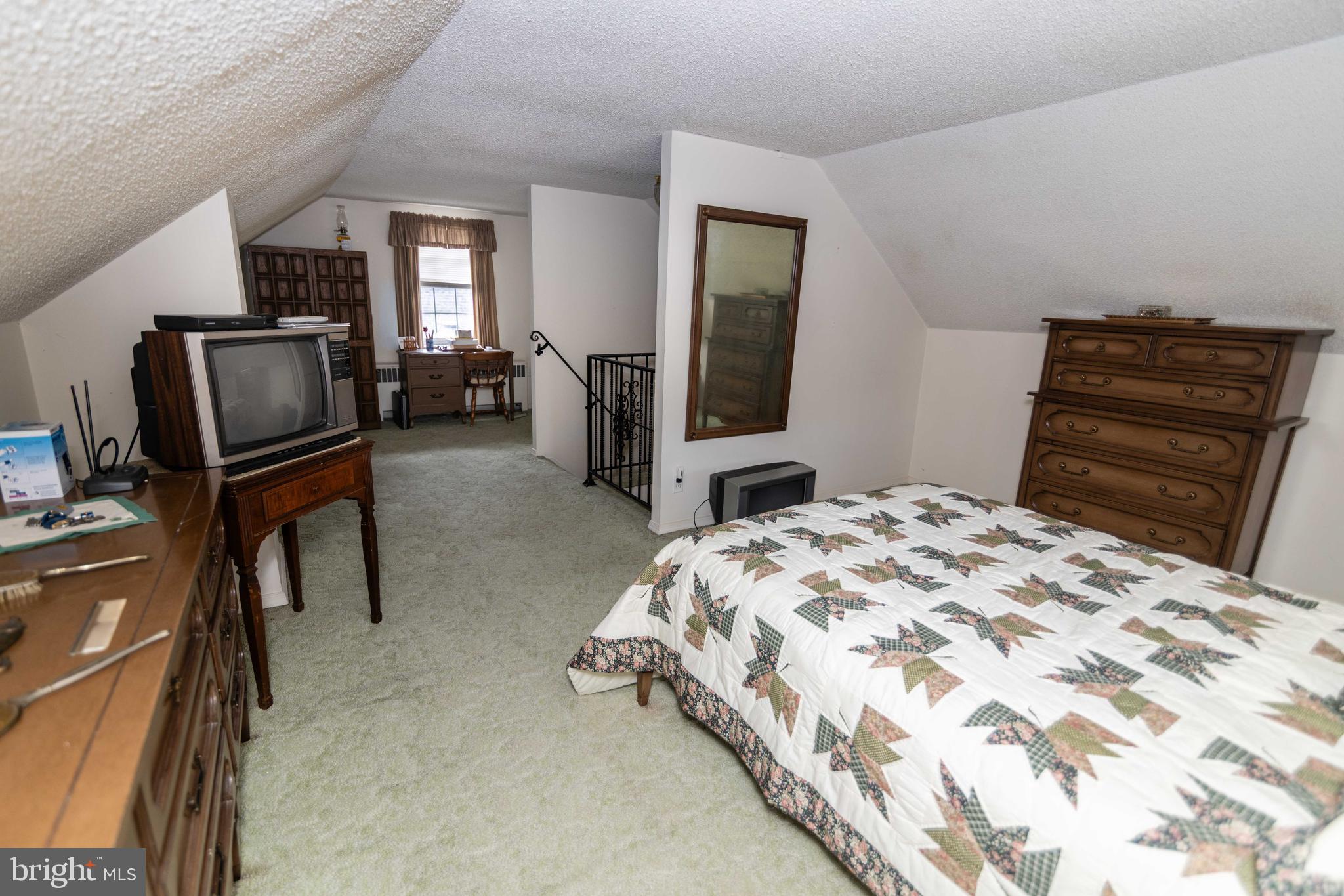 704 Hood Road Swarthmore, PA 19081 - Photo 21 of 34 a bedroom with a bed and furniture