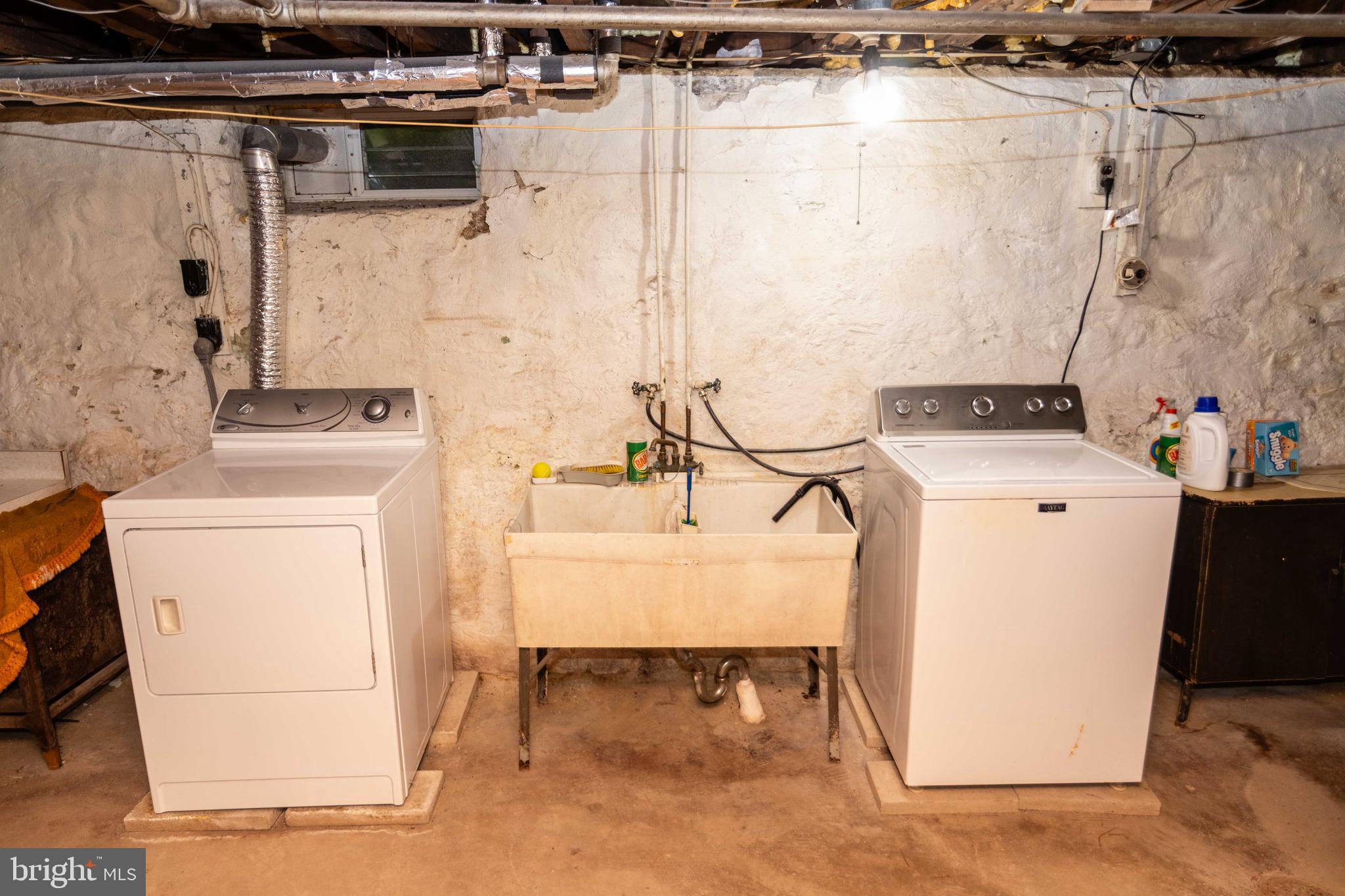 704 Hood Road Swarthmore, PA 19081 - Photo 23 of 34 a utility room with dryer and washer