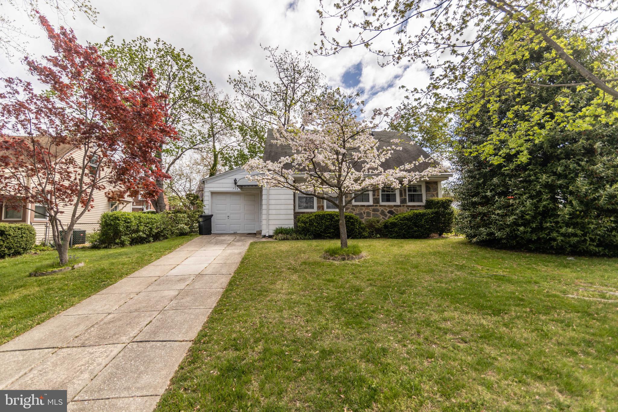 704 Hood Road Swarthmore, PA 19081 - Photo 33 of 34 a house with trees in front of it