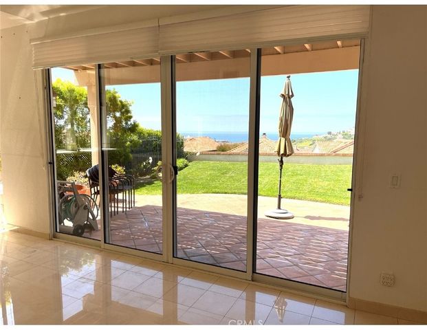 a view of a glass door and an empty room