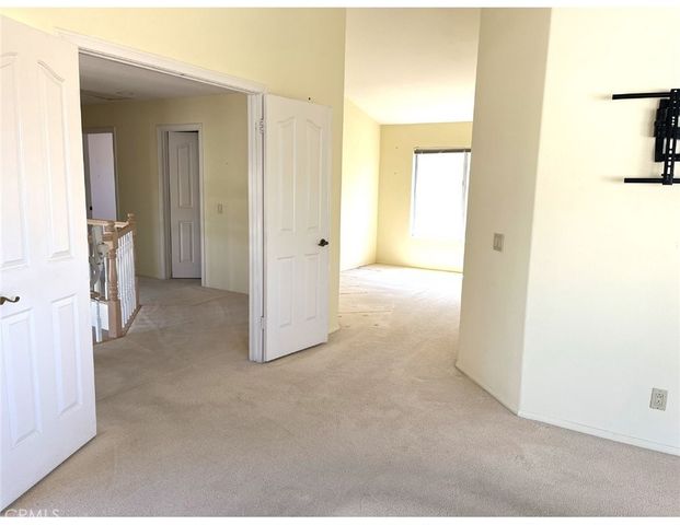 a view of a room with a hallway