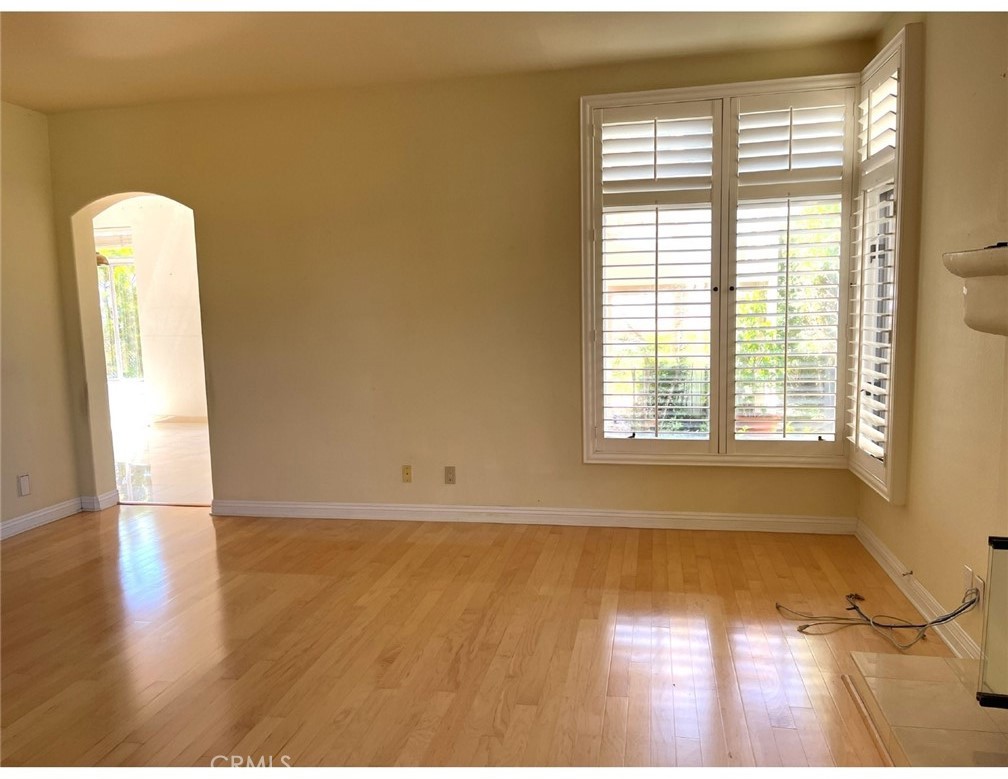 23 San Raphael Dana Point, CA 92629 - Photo 6 of 24 a view of empty room with wooden floor and fan