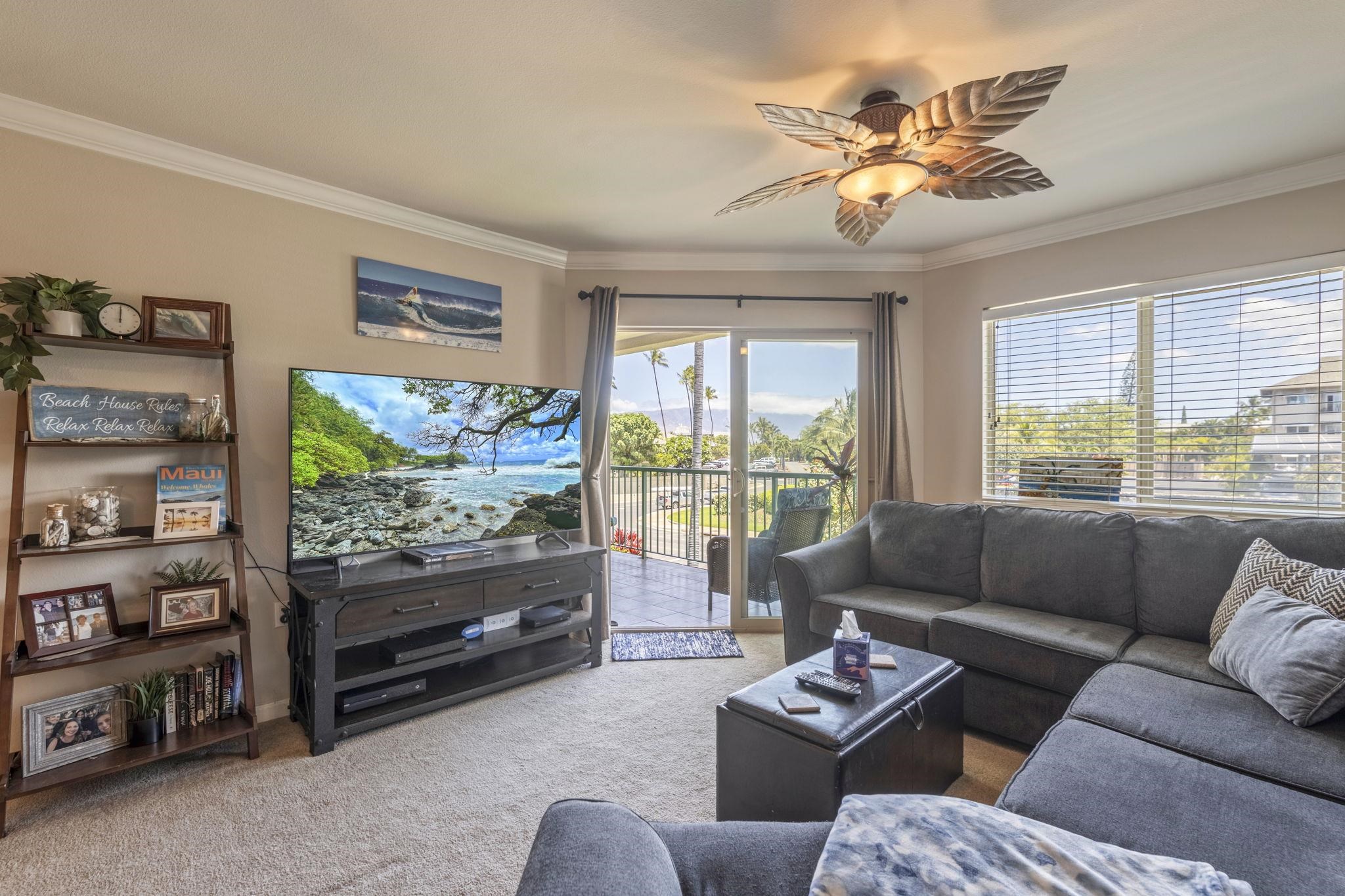 44 Kanani Road, Unit 2202 Kihei, HI 96753 - Photo 15 of 42 a living room with furniture and a flat screen tv