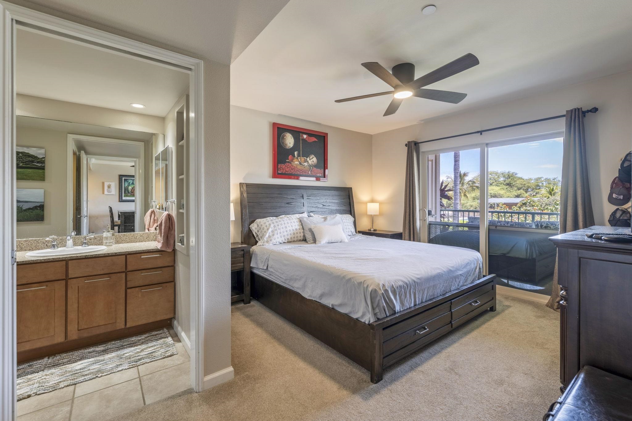 44 Kanani Road, Unit 2202 Kihei, HI 96753 - Photo 17 of 42 a bedroom with a large bed and a window