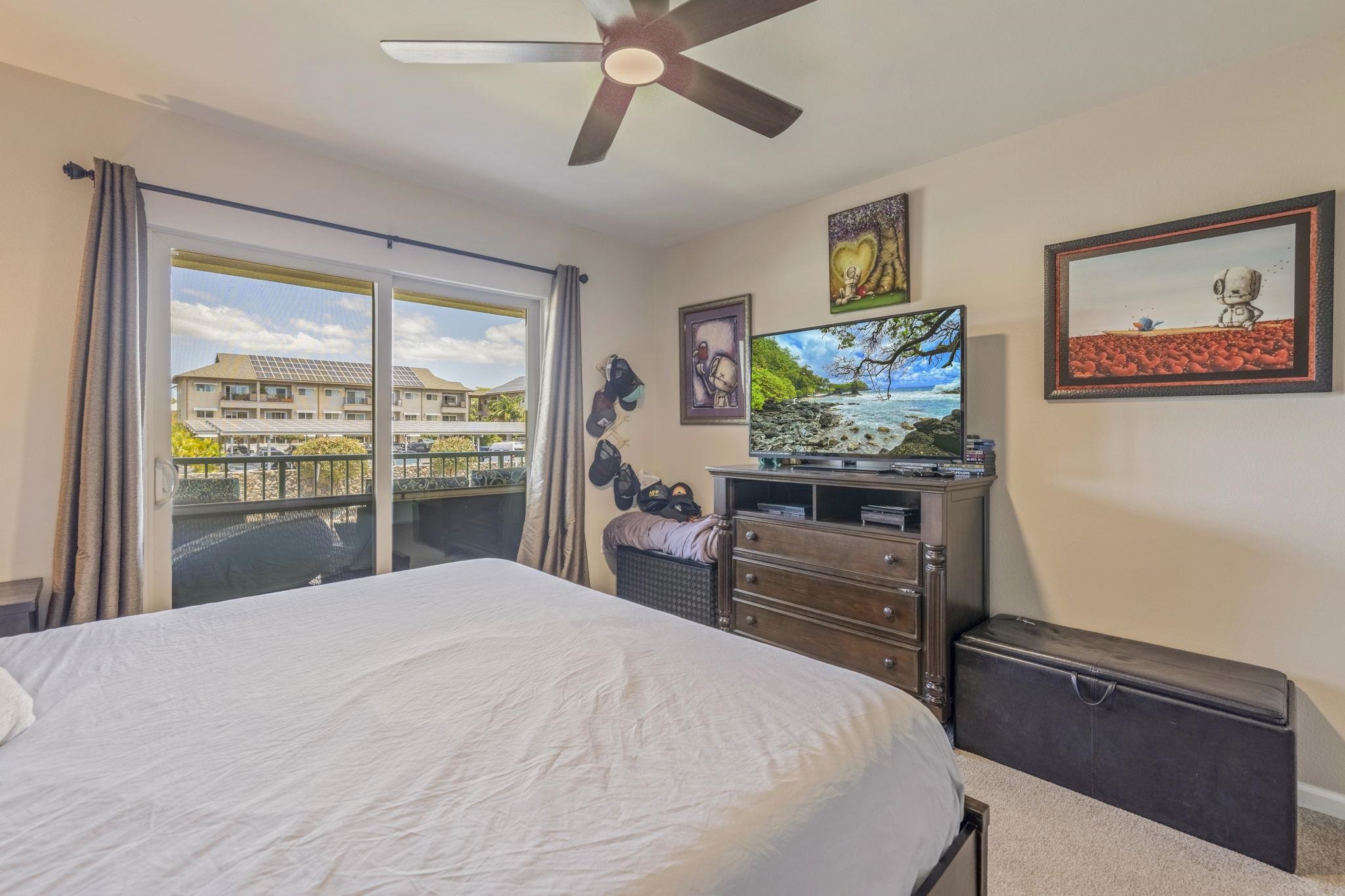 44 Kanani Road, Unit 2202 Kihei, HI 96753 - Photo 18 of 42 a bedroom with a bed and a flat screen tv
