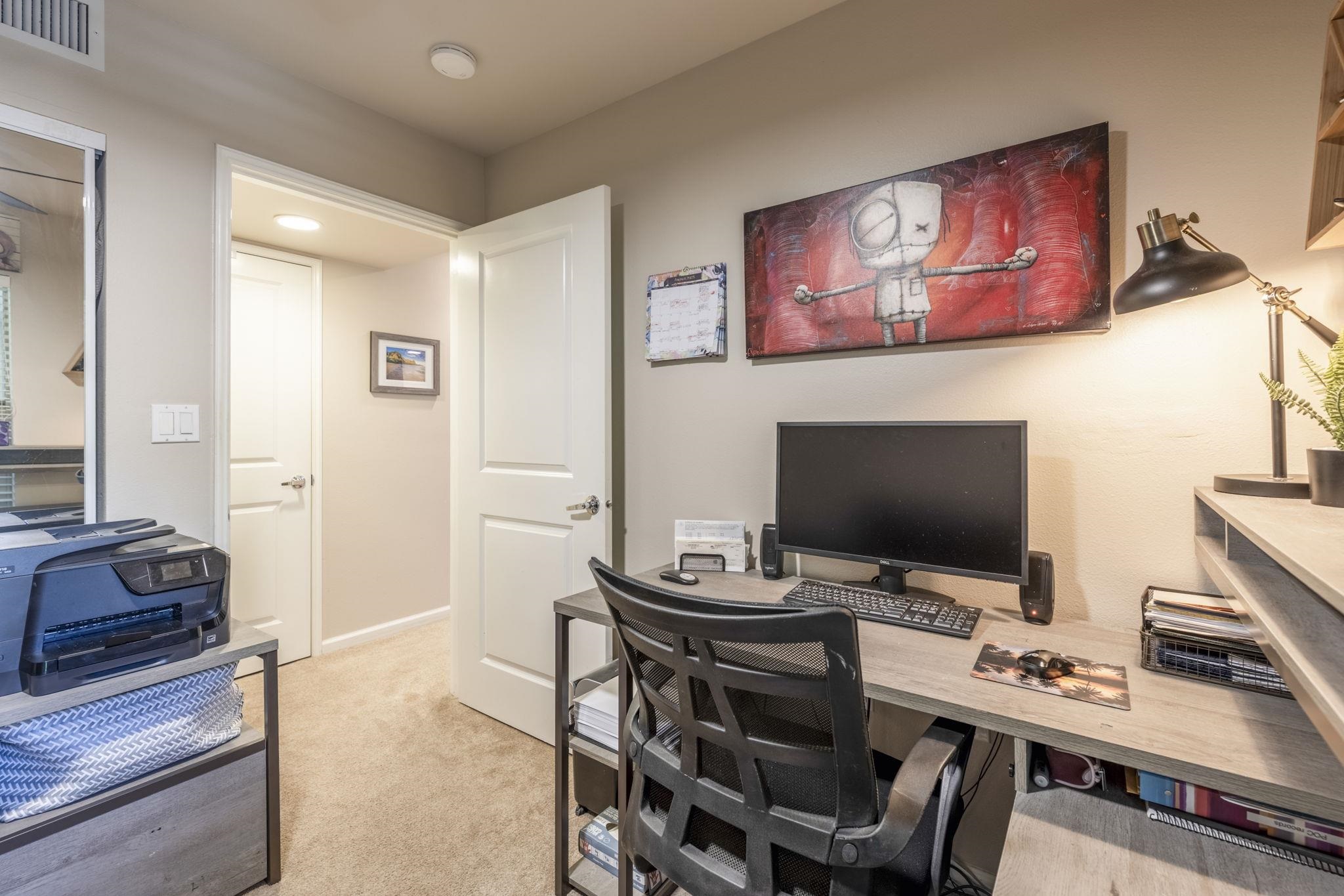 44 Kanani Road, Unit 2202 Kihei, HI 96753 - Photo 22 of 42 a view of a workspace with furniture and wooden floor