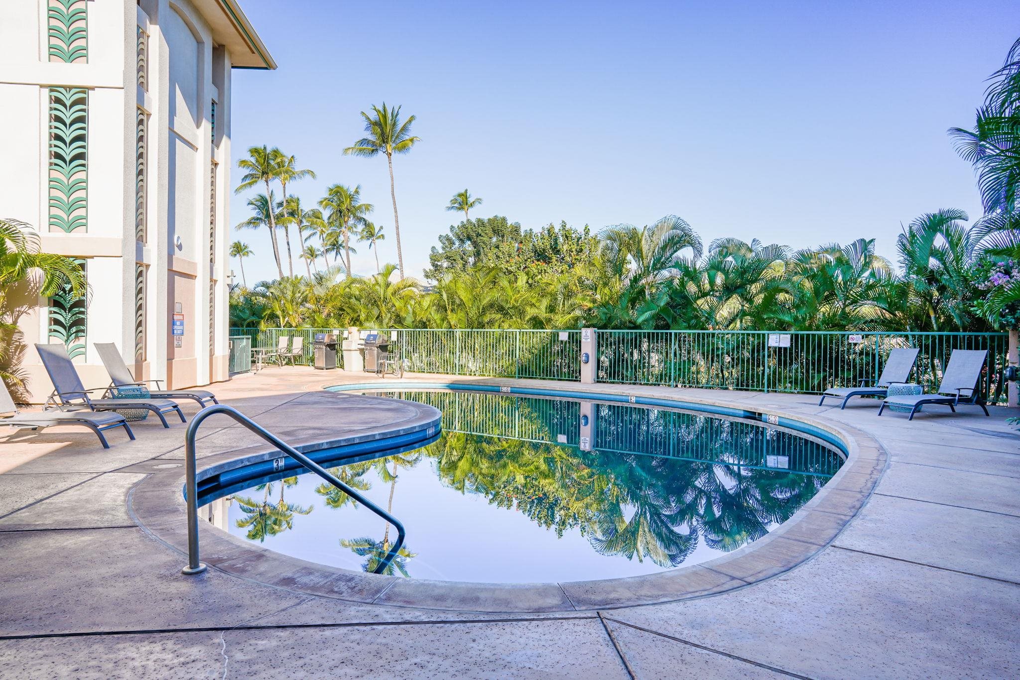 44 Kanani Road, Unit 2202 Kihei, HI 96753 - Photo 32 of 42 a view of a swimming pool with chairs