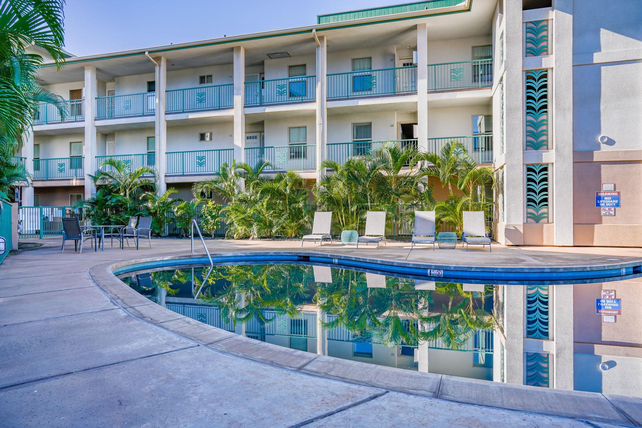 44 Kanani Road, Unit 2202 Kihei, HI 96753 - Photo 35 of 42 a view of a brick building next to a yard