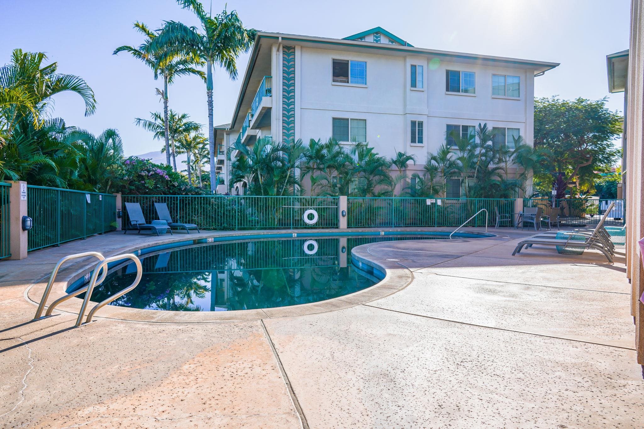 44 Kanani Road, Unit 2202 Kihei, HI 96753 - Photo 36 of 42 a view of a backyard with a barbeque plants and palm trees