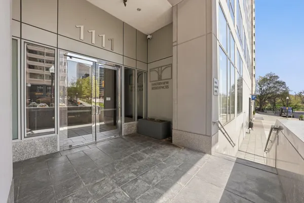 a view of an entryway with a floor to ceiling window