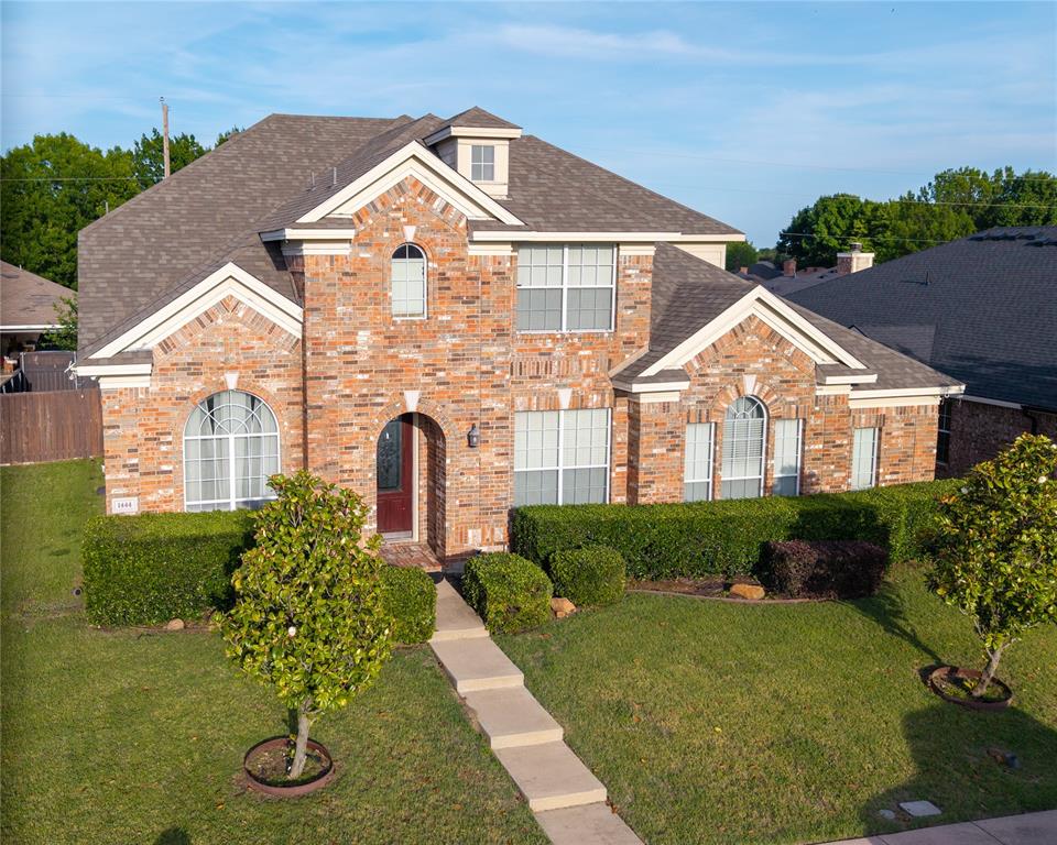 1444 Mercury Lane Lancaster, TX 75134 - Photo 1 of 19 a front view of a house with garden