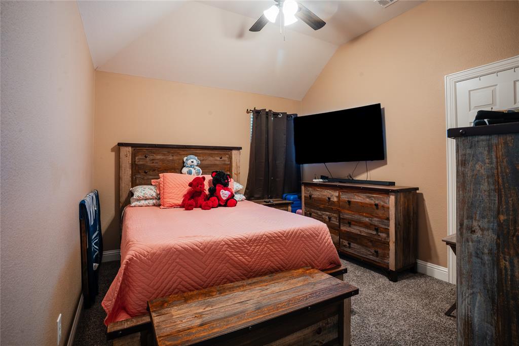 1444 Mercury Lane Lancaster, TX 75134 - Photo 15 of 19 a bedroom with a bed and a flat screen tv