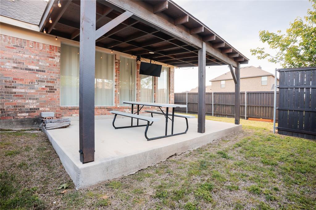 1444 Mercury Lane Lancaster, TX 75134 - Photo 19 of 19 a view of a swimming pool with a porch