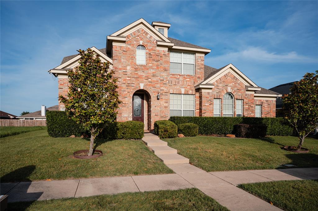 1444 Mercury Lane Lancaster, TX 75134 - Photo 2 of 19 a front view of a house with a yard