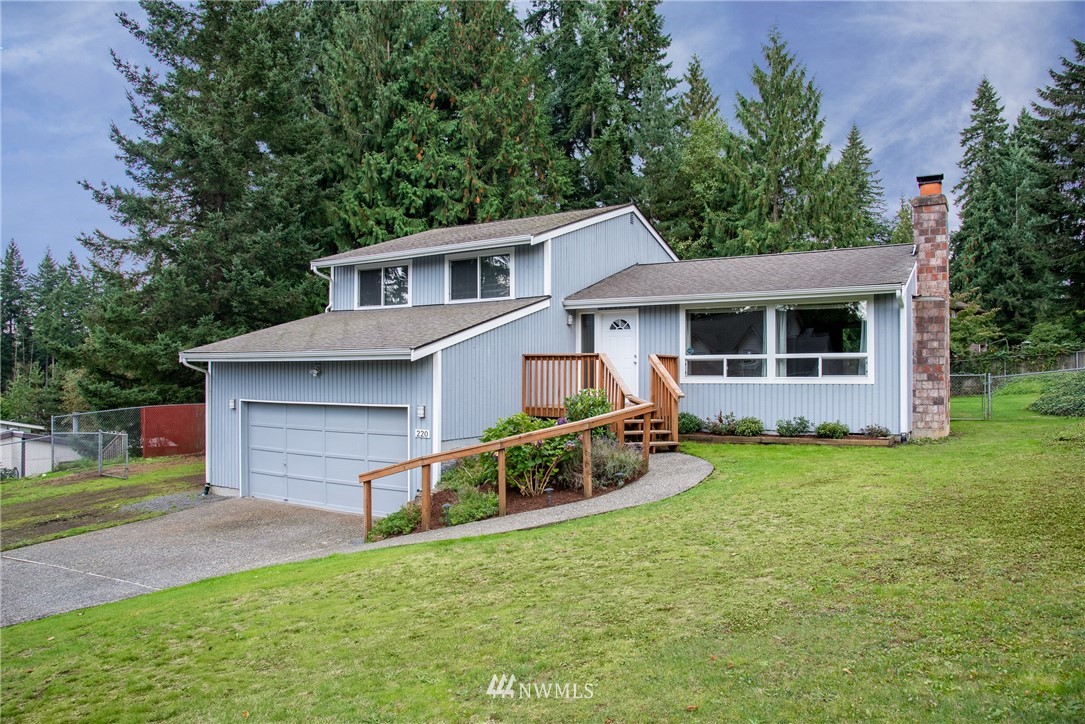 220 154th Place Southeast Bothell, WA 98012 - Photo 1 of 25 front view of a house with a yard