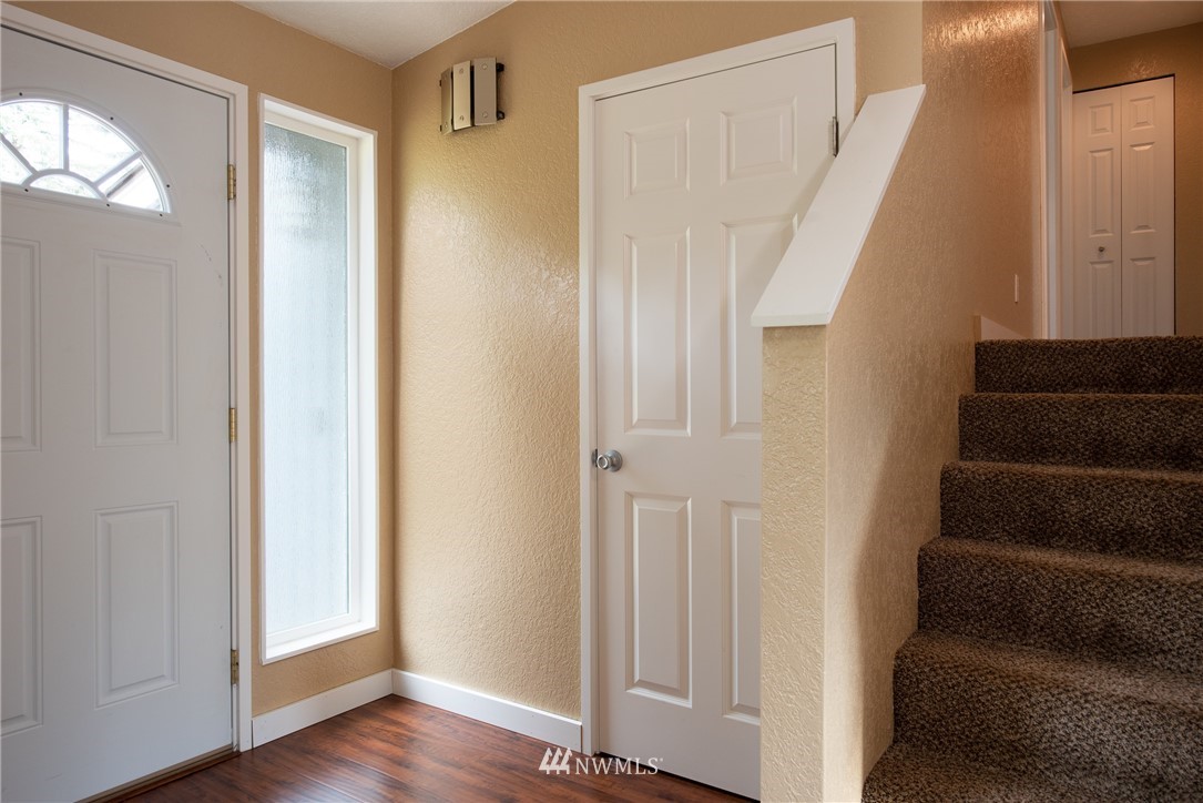 220 154th Place Southeast Bothell, WA 98012 - Photo 11 of 25 a view of entryway with wooden floor and stairs