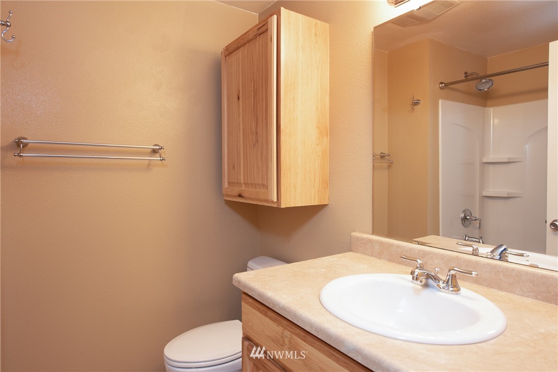 220 154th Place Southeast Bothell, WA 98012 - Photo 12 of 25 a bathroom with a sink toilet and shower