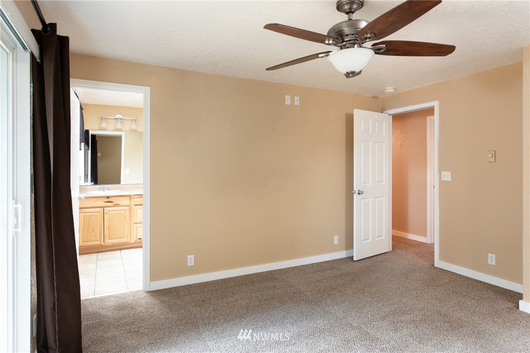 220 154th Place Southeast Bothell, WA 98012 - Photo 14 of 25 an empty room with closet and a chandelier fan