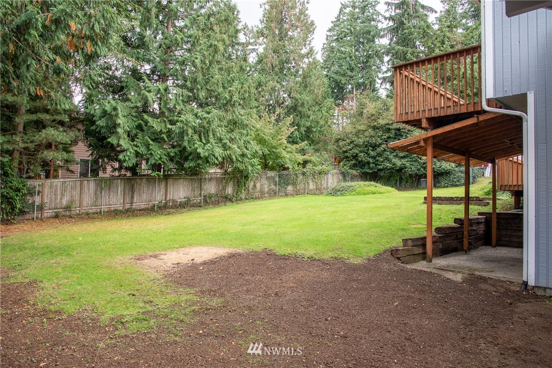220 154th Place Southeast Bothell, WA 98012 - Photo 23 of 25 a view of a house with backyard and pool
