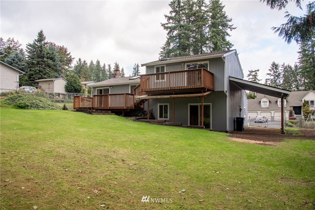220 154th Place Southeast Bothell, WA 98012 - Photo 24 of 25 a view of a house with a yard and sitting area