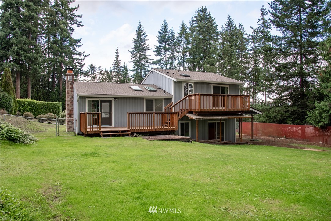 220 154th Place Southeast Bothell, WA 98012 - Photo 25 of 25 a view of a house with a yard and sitting area