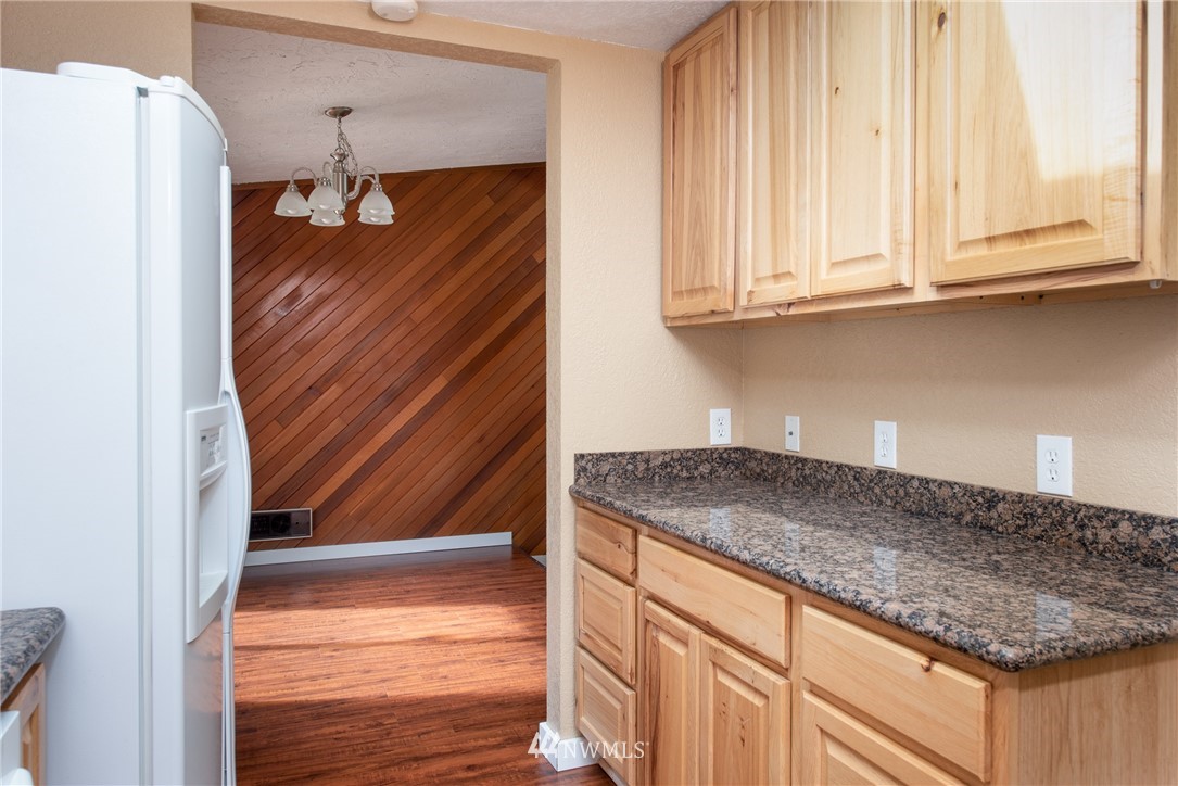 220 154th Place Southeast Bothell, WA 98012 - Photo 10 of 25 a kitchen with a sink and a refrigerator