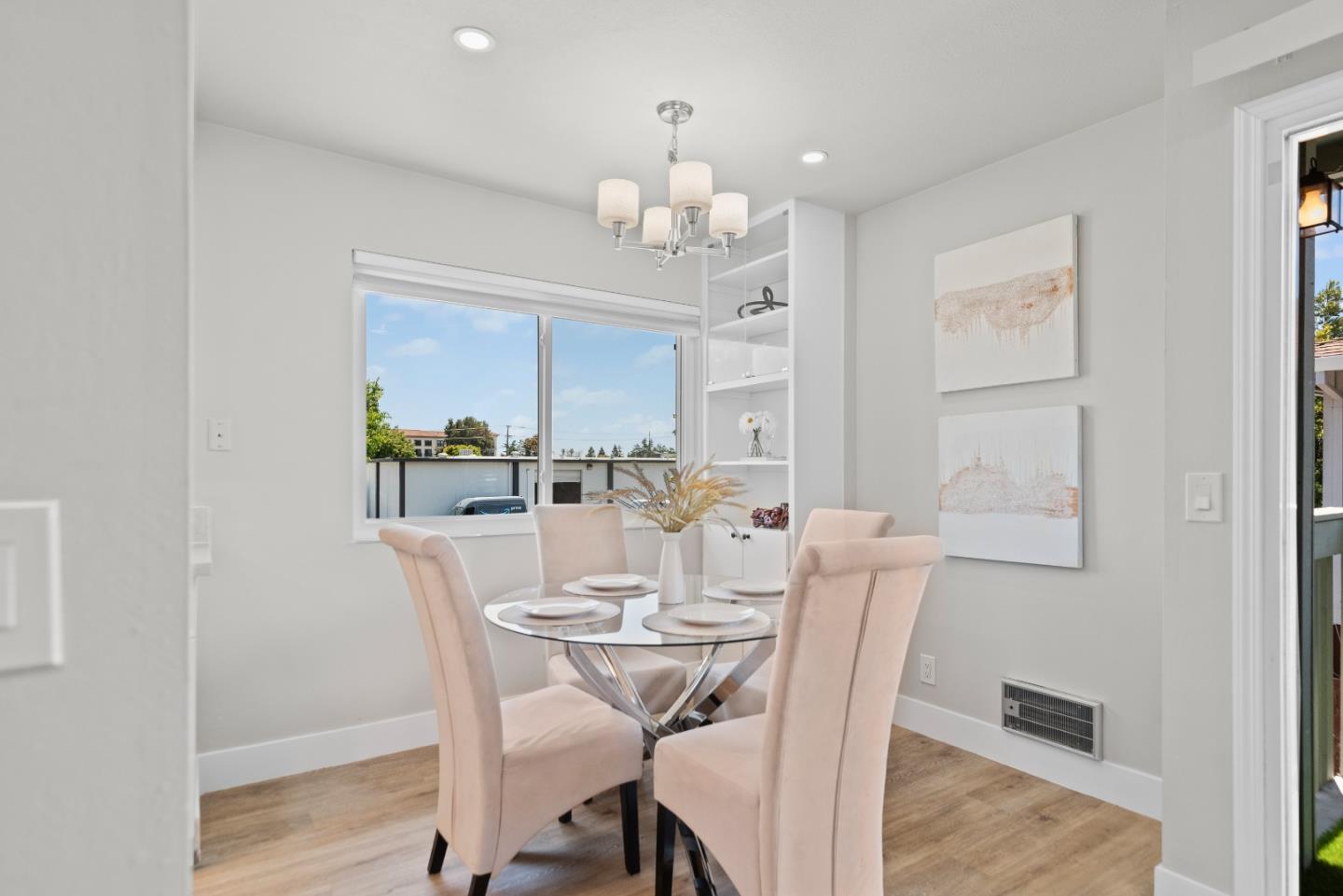 1135 Reed Avenue, Unit D Sunnyvale, CA 94086 - Photo 9 of 24 a view of a dining room with furniture window and wooden floor