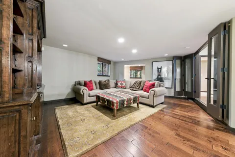 a bedroom with a bed and large window