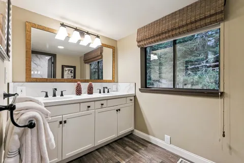 a bedroom with a bed and a television