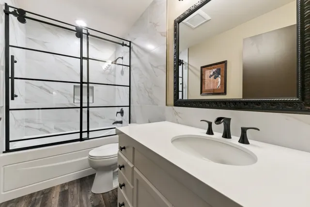 a bedroom with a bed couch and window